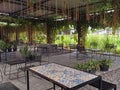 iron tables and chairs in a cafe interior with an industrialist theme