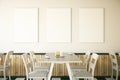 Cafe interior with three posters