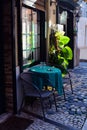 Cafe in Lisbon. Authentic Portugal. Street photo. Colorful and bright. Reflection. Table and chairs. Green blue black brown Royalty Free Stock Photo