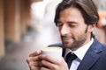 Cafe, man and worker for business, dreaming and relax when outdoor on break in winter for warmth. Professional male Royalty Free Stock Photo