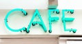 cafe neon sign in blue green Royalty Free Stock Photo