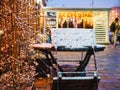 cafe outdoor table and chair covered with snow at winter evening Royalty Free Stock Photo