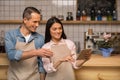 Cafe owners using digital tablet Royalty Free Stock Photo