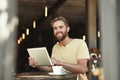 Cafe portrait, tablet and happy man, customer or freelance worker doing online project, research or report article