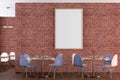 Cafe or restaurant intrerior with blank vertical poster on the red brick wall. Royalty Free Stock Photo