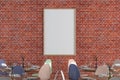 Cafe or restaurant intrerior with blank vertical poster on the red brick wall. Royalty Free Stock Photo