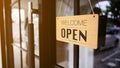 Cafe or restaurant reopens and shows sign wood board label with message WELCOME WE ARE OPEN PLEASE COME after Coronavirus Royalty Free Stock Photo