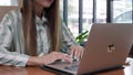 A cafe serves as the workplace for a young Ukrainian woman who freelances on her computer.