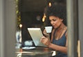 Cafe shop, tablet and woman reading project data, research insight or small business report of monthly sales income