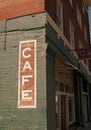 Cafe sign on historic brick building