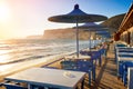 Cafe on sunset beach with beautiful view to the Mediterranean S