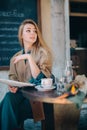 Cafe table customer young woman coffee cup newspaper lifestule Royalty Free Stock Photo