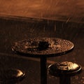 Cafe table in the night rain Royalty Free Stock Photo