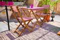 cafe table.purple color chairs wooden made. Royalty Free Stock Photo