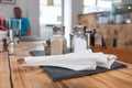 A cafe table setting with a customer relaxing in the background. Royalty Free Stock Photo