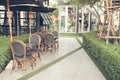 Cafe with tables and chairs in an old street in Europe with retro vintage Instagram style filter effect Royalty Free Stock Photo