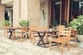 Cafe with tables and chairs in an old street in Europe with retro vintage Instagram style filter. Royalty Free Stock Photo