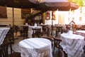 cafe - tables with chairs placed on street Royalty Free Stock Photo