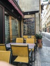 Cafe tables and chairs at Polidor Restaurant in Paris