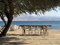 Cafe tables on Dekel Beach in Eilat Royalty Free Stock Photo