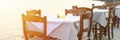 Cafe tables on the sea mediterranean embankment. selective focus. banner. flare. Royalty Free Stock Photo