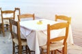 Cafe tables on the sea mediterranean embankment. selective focus. flare. Royalty Free Stock Photo