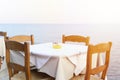 Cafe tables on the sea mediterranean embankment. selective focus. flare. Royalty Free Stock Photo