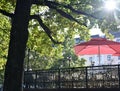 cafe terrace in the park in the shade of trees Royalty Free Stock Photo