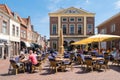 Cafe terrace with people on Markt in Brielle, Netherlands