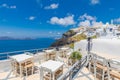 Cafe on terrace. Santorini island, Greece. Beautiful travel destination. Luxury vacation, idyllic summer holiday