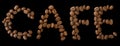 Cafe word made of coffee beans on black background - close up concept stock