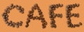 Cafe word made of coffee beans on brown background - close up concept - stock