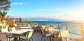 Cafes. Seascape. Greece Royalty Free Stock Photo