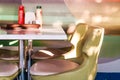 Cafeteria. Table with green chairs