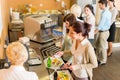 At the cafeteria woman pay bill Royalty Free Stock Photo