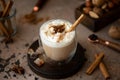 caffe latte with whipped cream, cinnamon and anise Royalty Free Stock Photo