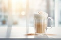 coffee latte layered with whipped cream on white table Royalty Free Stock Photo