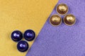 Caffeine, hot drinks and objects concept - close up colorful capsules or pods for coffee mashine on glittery purple and gold backg