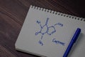 Caffeine write on the book. Structural chemical formula. Education concept