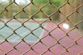 Cage of blurred tennis court background Royalty Free Stock Photo