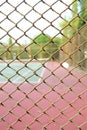 Cage of blurred tennis court background