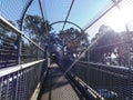 Cage protected walkway over motorway