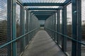 Caged footbridge over motorway, view from inside