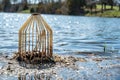 Caged pond overflow spillway cover with buildup Royalty Free Stock Photo