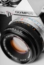 Cagliari, Italy - 16 April 2015: Film reflex camera model Olympus OM-2 close up, with 50mm f1.8 Olympus F.Zuiko