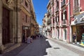 People walking in the one of many narrow shopping streets in Cagliari, Sardinia, Italy