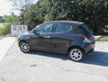 Black Lancia Ypsilon car in Cagliari