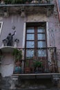 Terrace with small altar. Altar with Jesus statue on an old balcony on the facade of a house. Stock photos