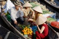 People visit famous floating market in Cai Be, Vietnam. Royalty Free Stock Photo