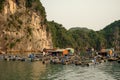 Cai Beo floating village on sunset in Ha Long Bay